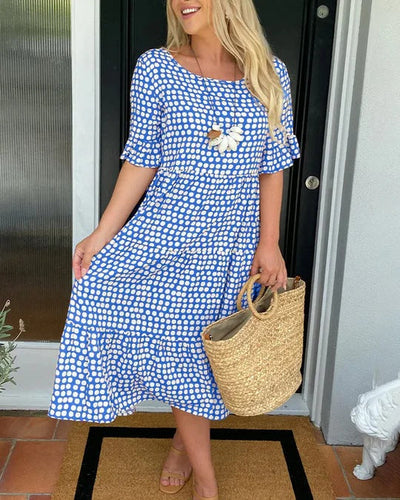 Jessika | Elegant midiklänning med lekfulla volangdetaljer